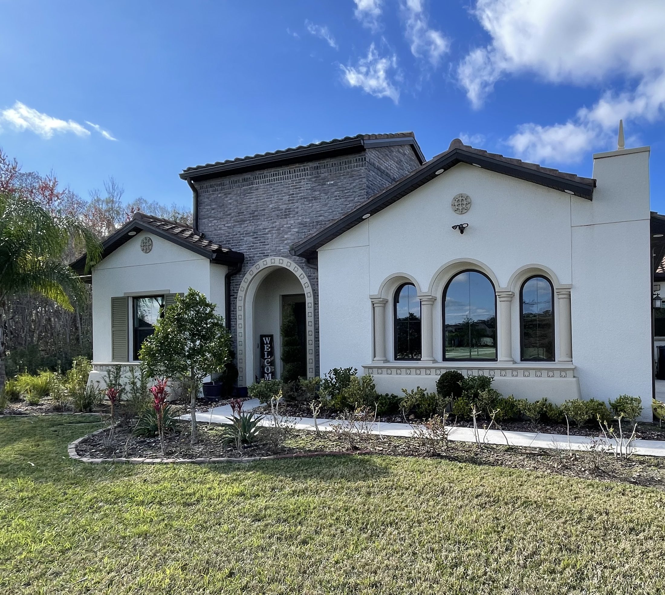 Spanish-style Tampa home with freshly cleaned arched windows